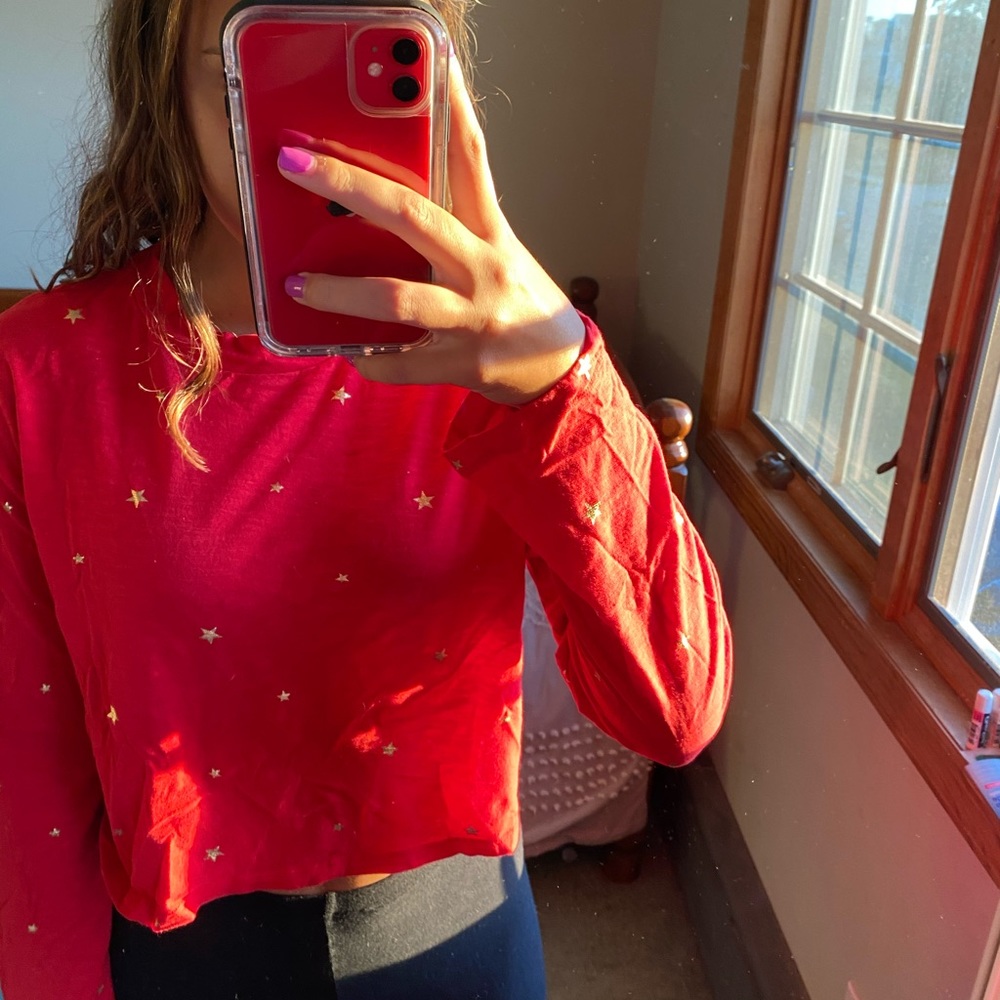Red shirt with gold stars from Pink